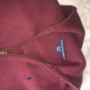 Burgundy polo sweater.